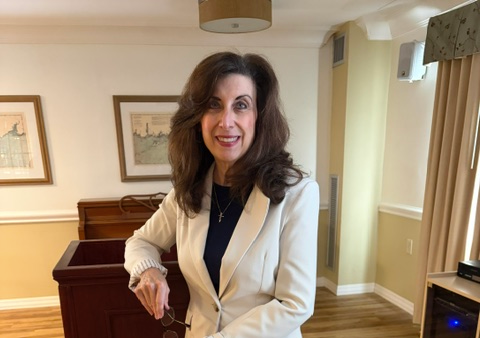 Jennifer Covello at podium for speaking event